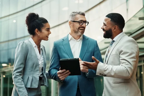 business-people-happy-outdoor-with-tablet-city-financial-report-update-feedback-new-york-downtown-employees-smile-as-accountants-with-teamwork-collaboration-plan